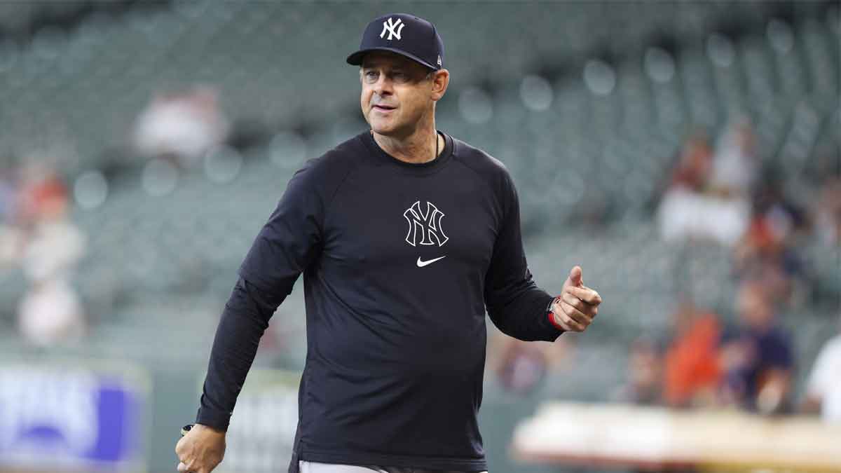 New York Yankees manager Aaron Boone stands on the field before the game against the Houston Astros at Daikin Park.