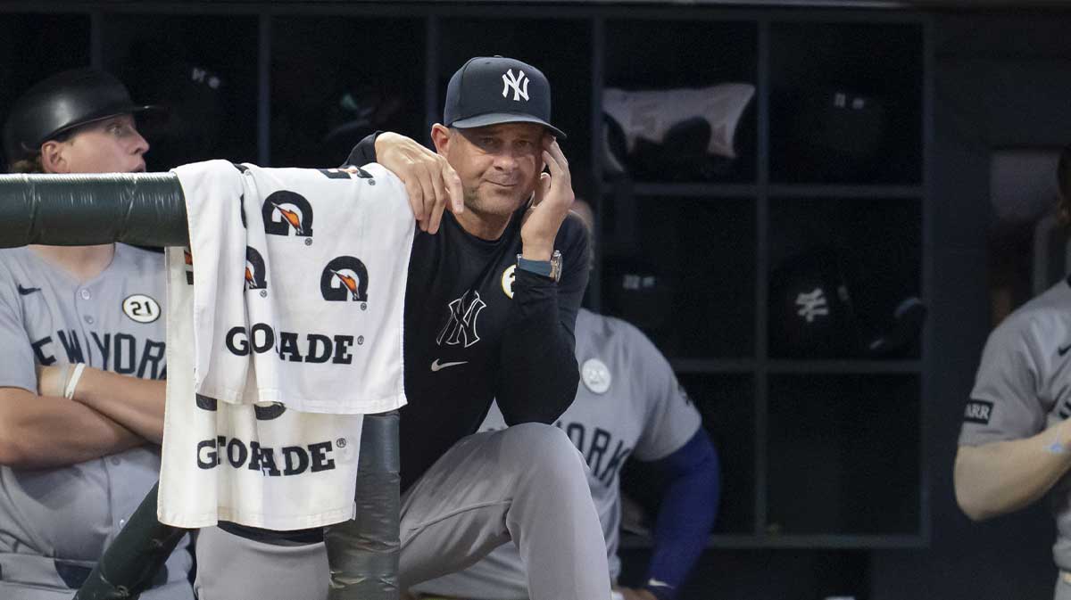 New York Yankees manager Aaron Boone looks on from the dugout against the Minnesota Twins during the fourth inning at Target Field.