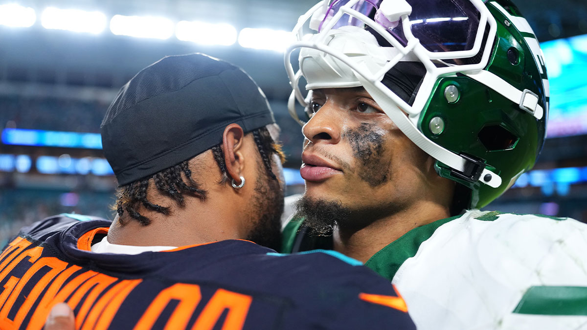 New York Jets quarterback Justin Fields (7) and Miami Dolphins quarterback Tua Tagovailoa (1) greet each other after the game at Hard Rock Stadium. Mandatory Credit: