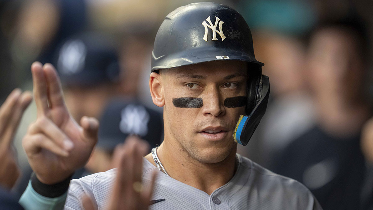 New York Yankees right fielder Aaron Judge (99) celebrates with teammates in the dugout after scoring a run against the Minnesota Twins in the first inning at Target Field.