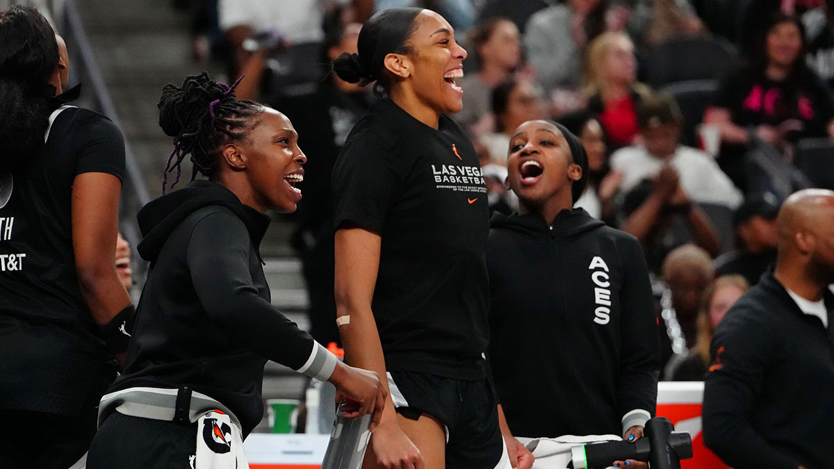 Aces guard Chelsea Gray (12), Las Vegas Aces center A'ja Wilson (22), and Las Vegas Aces guard Jackie Young (0) celebrate