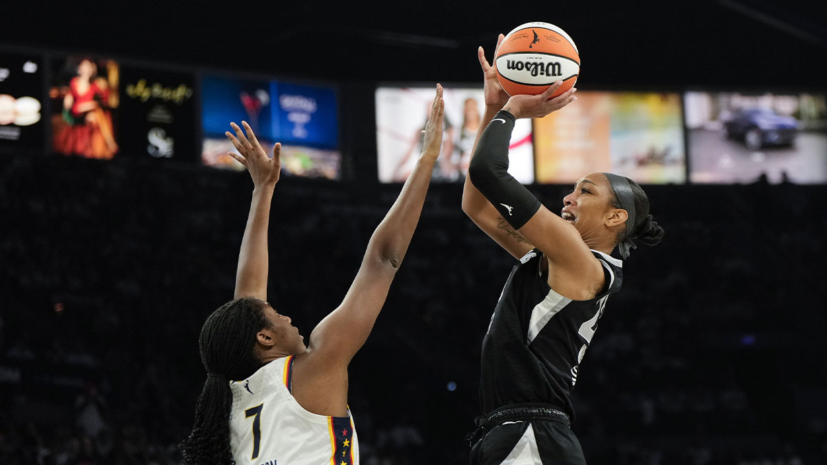 Las Vegas Aces center A'ja Wilson (22) shoots the ball against Indiana Fever center Aliyah Boston (7) during the third quarter in game one of the second round for the 2025 WNBA Playoffs at Michelob Ultra Arena.