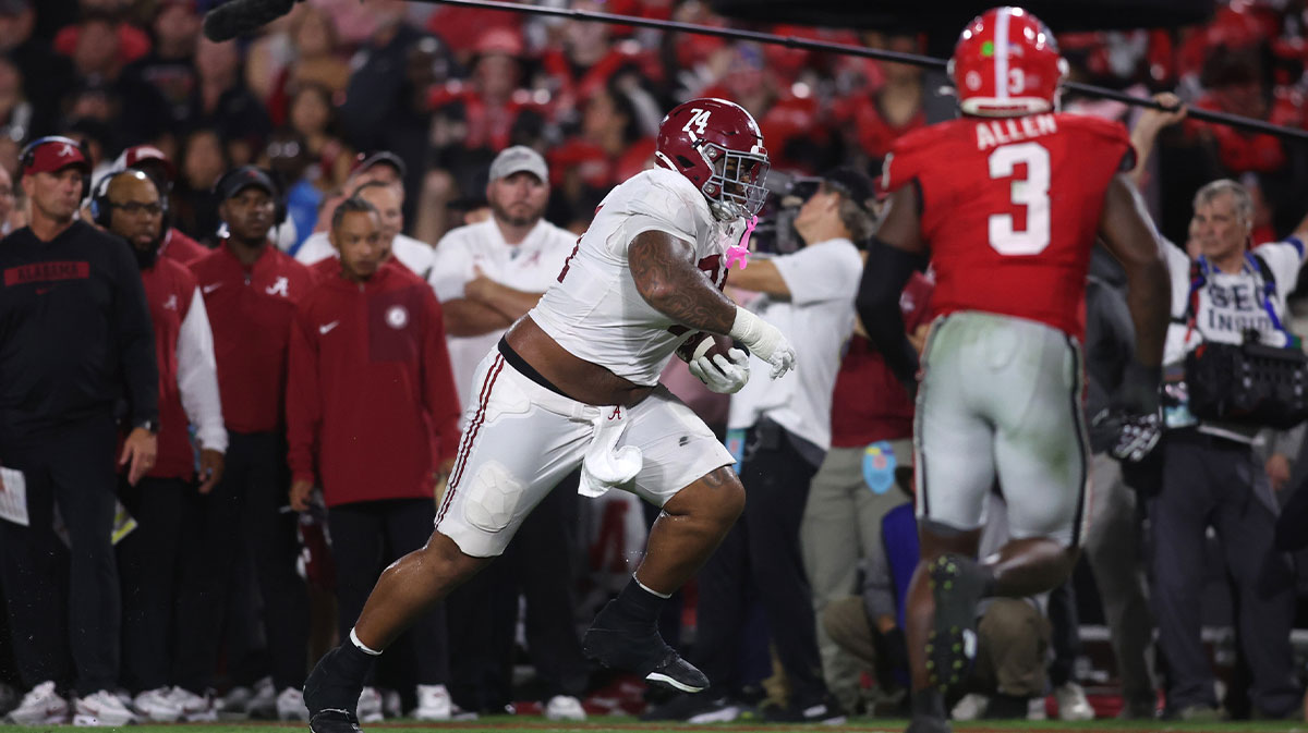 Alabama Crimson Tide offensive lineman Kadyn Proctor (74) runs against the Georgia Bulldogs in the second quarter at Sanford Stadium.