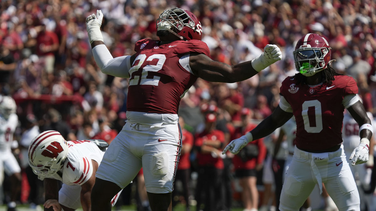 Alabama defensive lineman LT Overton (22) celebrates after sacking Wisconsin quarterback Danny O'Neil (18) at Saban Field at Bryant-Denny Stadium.