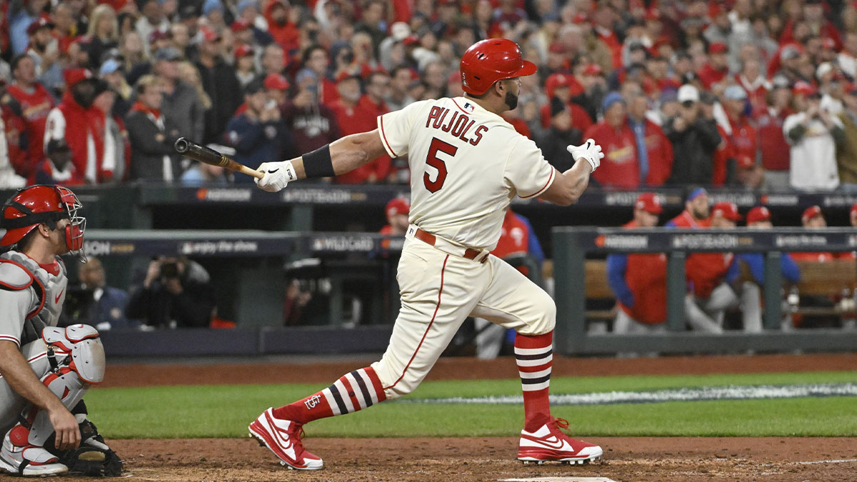 St. Louis Cardinals designated hitter Albert Pujols (5) hits a single in the eighth inning against the Philadelphia Phillies during game two of the Wild Card series for the 2022 MLB Playoffs at Busch Stadium.