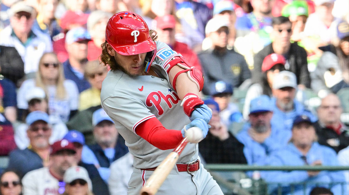 Philadelphia Phillies third baseman Alec Bohm (28) hits a triple against the Milwaukee Brewers in the seventh inning at American Family Field. 