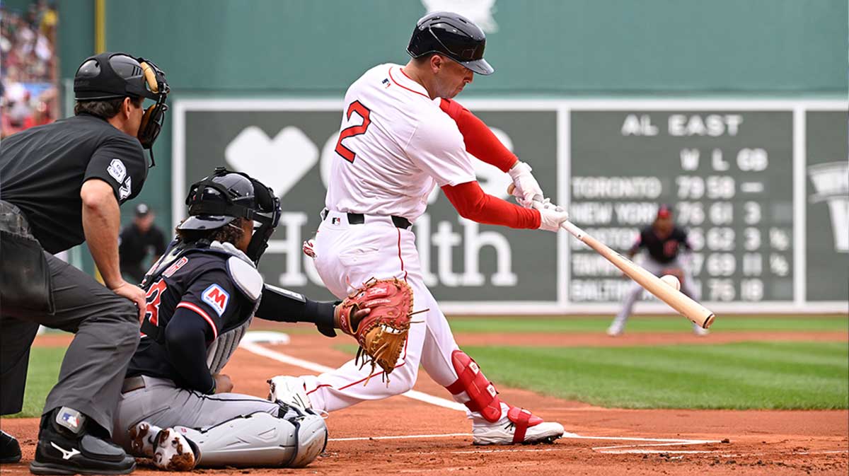 Boston Red Sox third baseman Alex Bregman (2) hits a double during the first inning against the Cleveland Guardians at Fenway Park