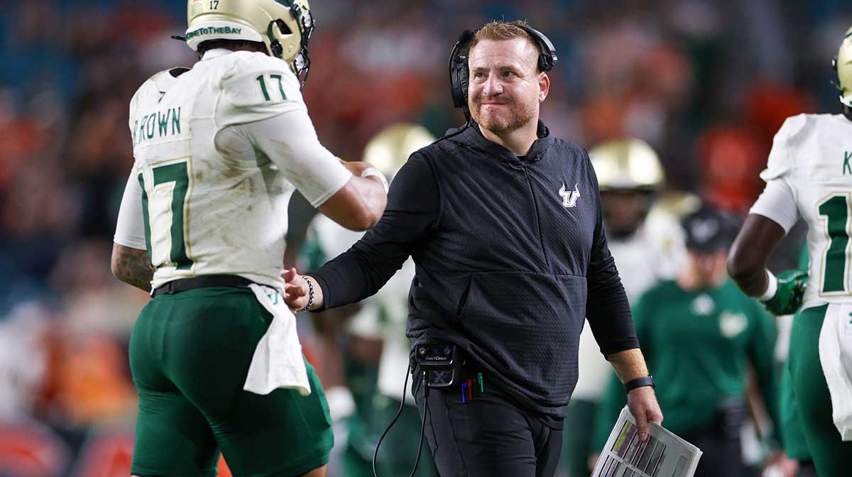South Florida Bulls head coach Alex Golesh lreacts to a play with quarterback Byrum Brown (17) against the Miami Hurricanes in the third quarter at Hard Rock Stadium.