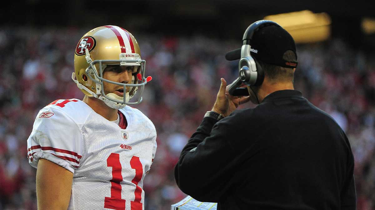 San Francisco 49ers quarterback Alex Smith (11) listens to head coach Jim Harbaugh (right) during the fourth quarter against the Arizona Cardinals at University of Phoenix Stadium. The Cardinals defeated the 49ers 21-19.