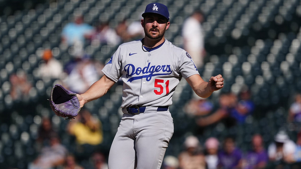 Los Angeles Dodgers relief pitcher Alex Vesia (51) reacts to the final out of the ninth inning against the Colorado Rockies at Coors Field.