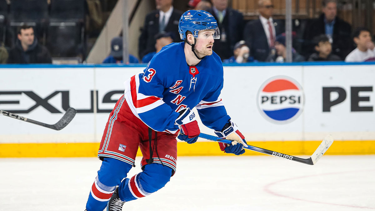 New York Rangers left wing Alexis Lafreniere (13) skates against the Vancouver Canucks during the third period at Madison Square Garden.