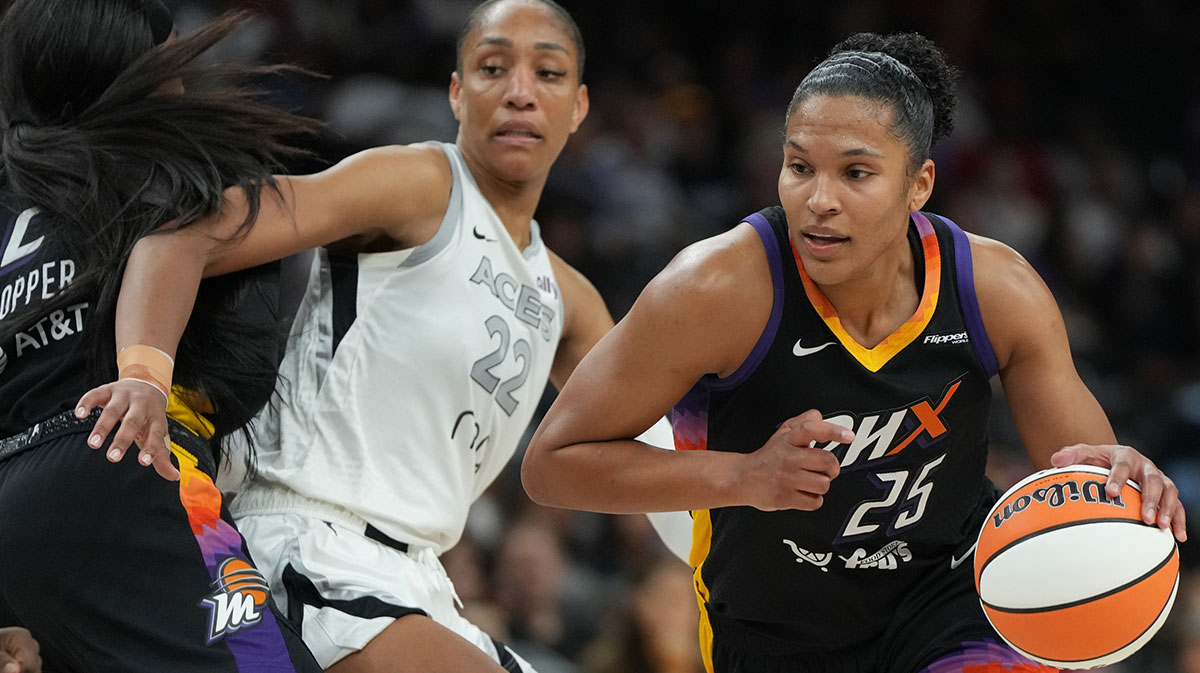 Phoenix Mercury forward Alyssa Thomas (25) drives around Las Vegas Aces center A'ja Wilson (22) in the second half at Footprint Center