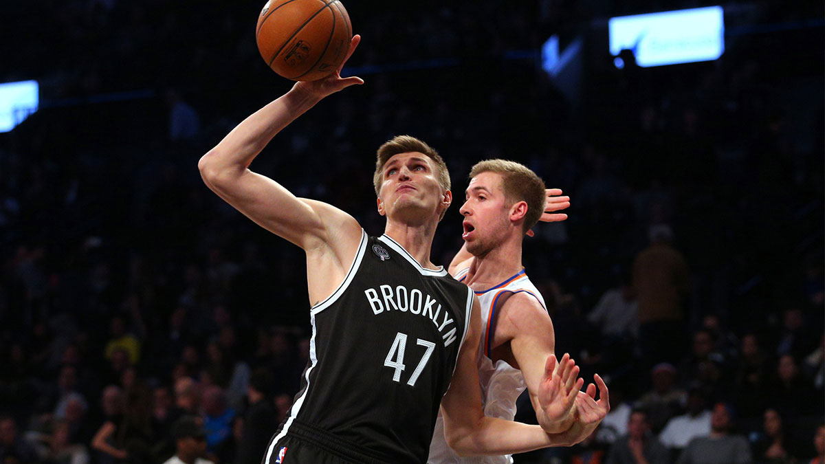 Brooklyn Nets small forward Andrei Kirilenko (47) grabs a rebound in front of New York Knicks small forward Travis Wear (6) during the fourth quarter at Barclays Center. The Nets defeated the Knicks 110-99.