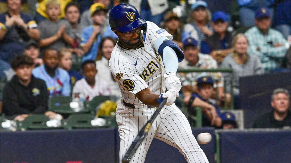 Milwaukee Brewers second baseman Andruw Monasterio (14) drives in the winning run in the tenth inning against the St. Louis Cardinals at American Family Field. 