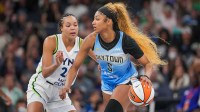Chicago Sky forward Angel Reese (5) dribbles against the Minnesota Lynx forward Napheesa Collier (24) in the fourth quarter at Target Center.