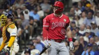 Los Angeles Angels outfielder Mike Trout (27) looks back at the replay after striking out against the Milwaukee Brewers in the sixth inning at American Family Field.