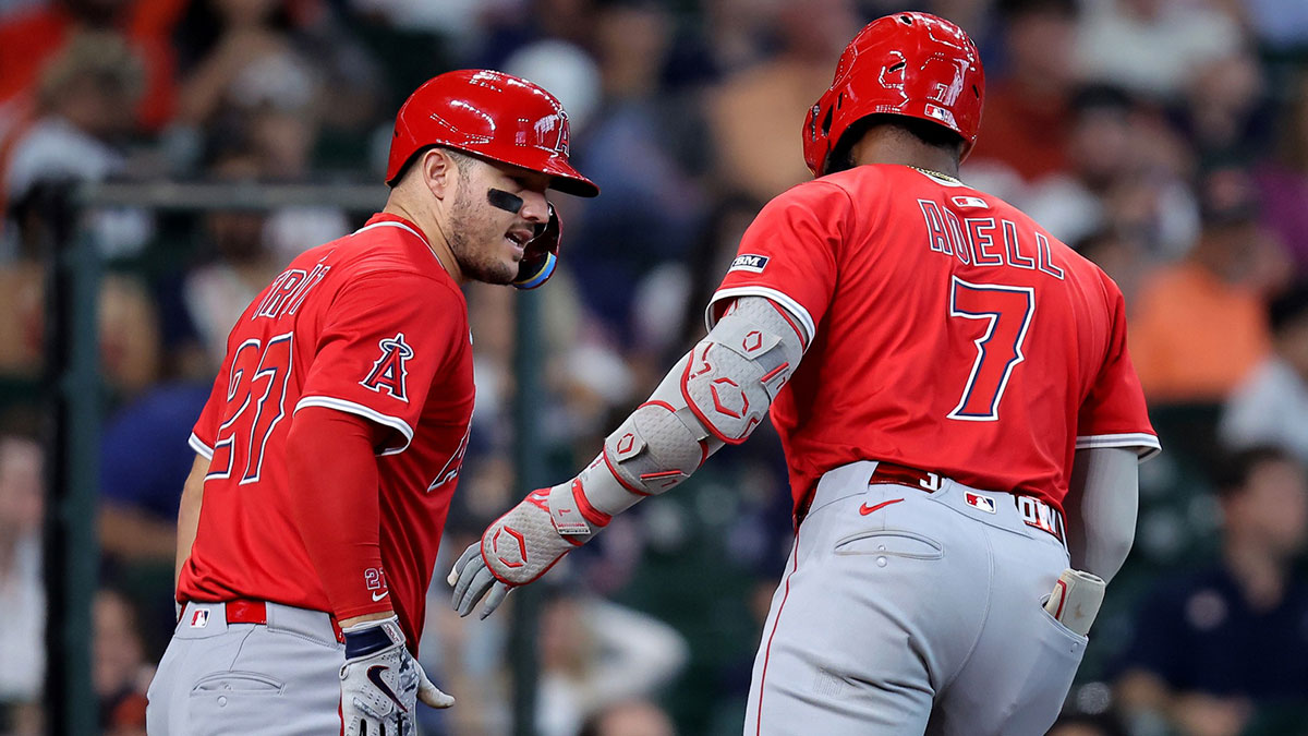 Los Angeles Angels right fielder Jo Adell (7) is congratulated by Los Angeles Angels designated hitter Mike Trout (27) after hitting a two run home run to left field against the Houston Astros during the fourth inning at Daikin Park.