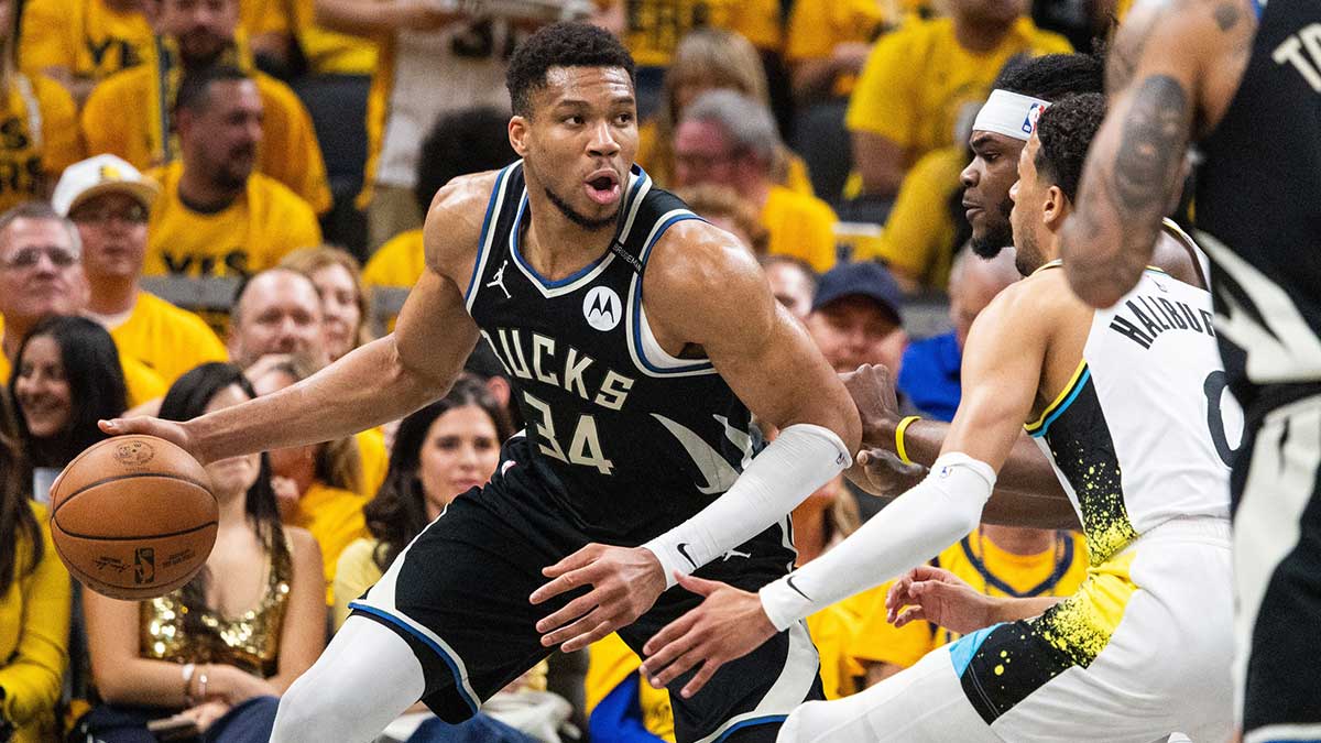 Milwaukee Bucks forward Giannis Antetokounmpo (34) dribbles the ball while Indiana Pacers forward Jarace Walker (5) defends during game five of the first round for the 2024 NBA Playoffs at Gainbridge Fieldhouse