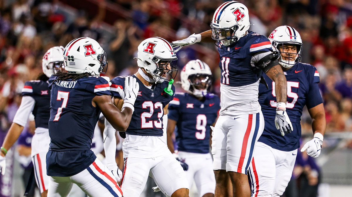 Arizona Wildcats defensive back Gavin Hunter (23) celebrates with teammate during the fourth quarter against the Kansas State Wildcats at Arizona Stadium.