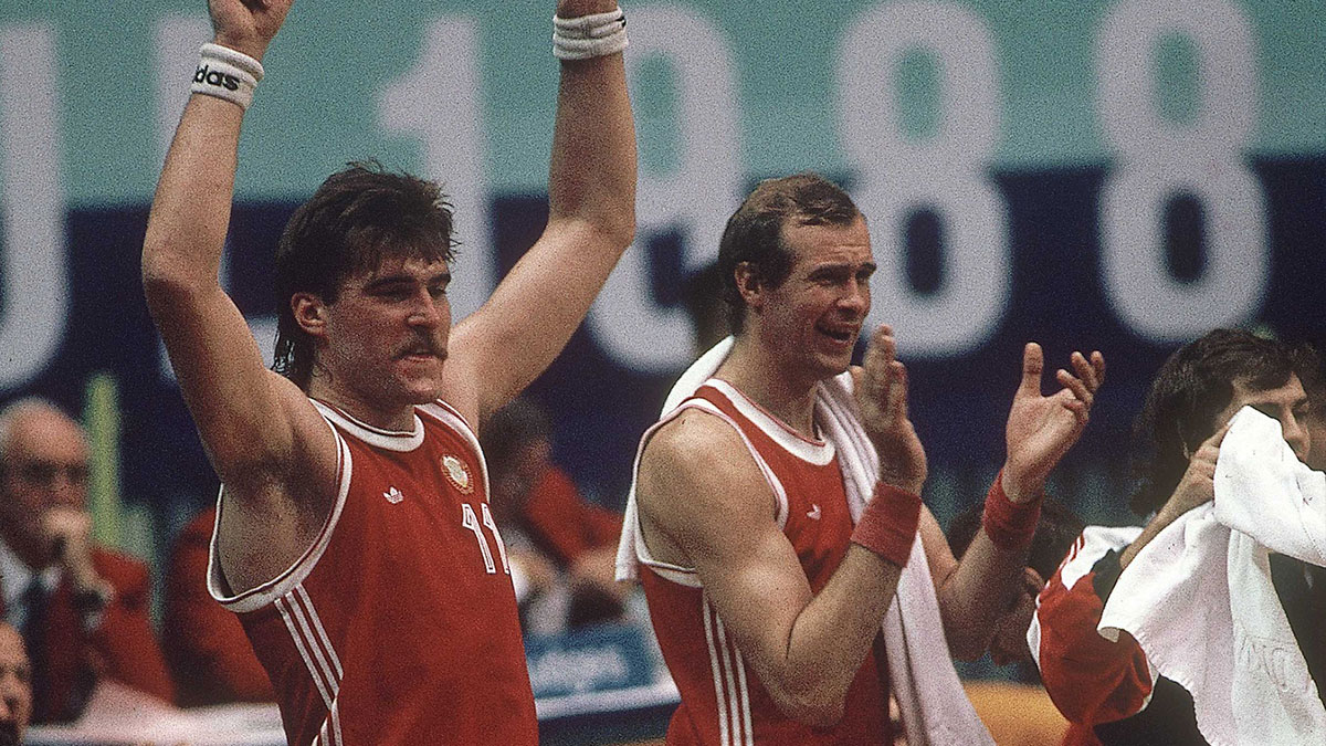 Arvydas Sabonis (left) and Oleksandr Bielostienniy (right) of the Soviet Union cheer from the sidelines during the men's basketball tournament at the 1988 Seoul Olympic Games at Jamsil Gymnasium.