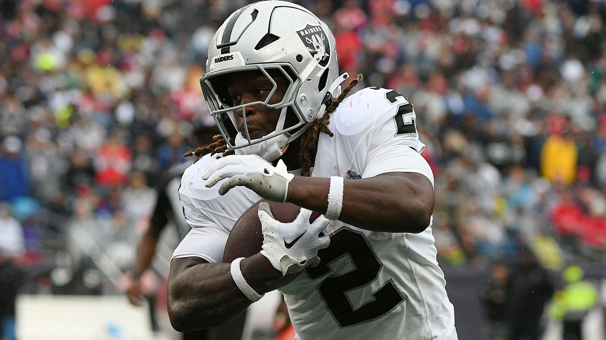 Las Vegas Raiders running back Ashton Jeanty (2) rushes the ball against the New England Patriots during he second half at Gillette Stadium.