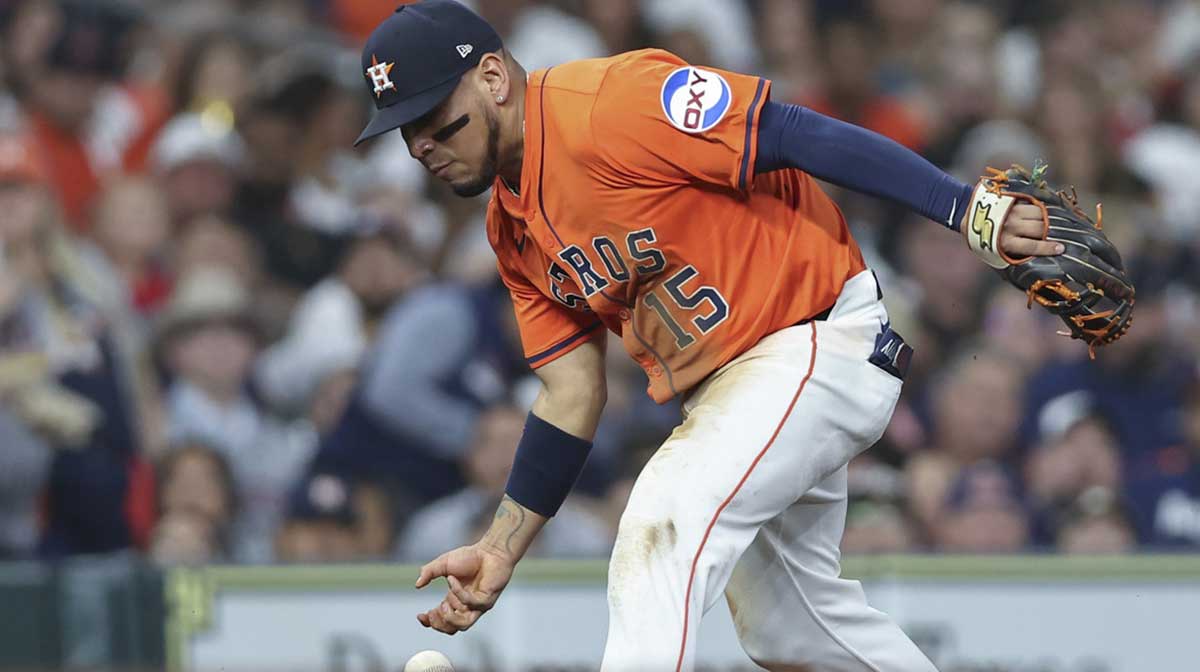 Houston Astros third baseman Isaac Paredes (15) is unable to make a play on a ground ball during the fifth inning against the Texas Rangers at Daikin Park.