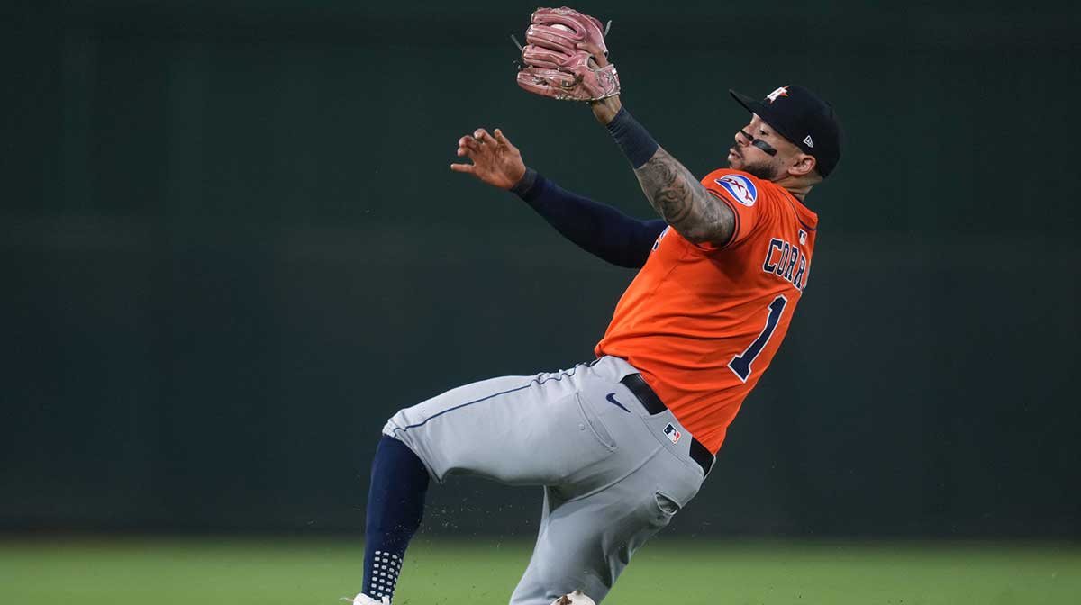 Houston Astros shortstop Carlos Correa (1) loses his footing after fielding a ground ball against the Athletics in the third inning at Sutter Health Park.