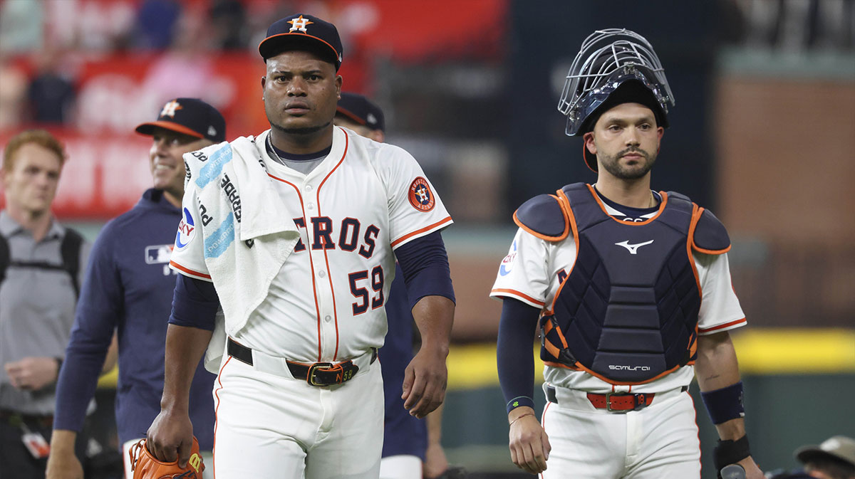 Houston Astros starting pitcher Framber Valdez (59) and catcher Cesar Salazar (18) walk to the dugout before the game against the New York Yankees at Daikin Park.