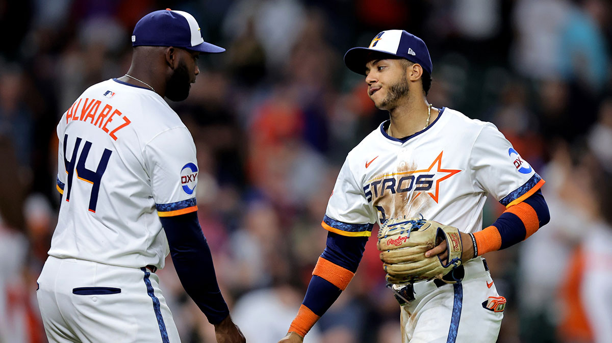 Astros designated hitter Yordan Alvarez (44) is congratulated by Houston Astros shortstop Jeremy Pena