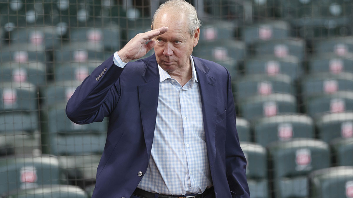 Houston Astros owner Jim Crane gives a salute before the game against the Cincinnati Reds at Daikin Park.
