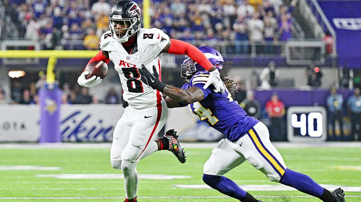 Minnesota Vikings safety Joshua Metellus (44) tackles Atlanta Falcons tight end Kyle Pitts Sr. (8) during the first half at U.S. Bank Stadium.