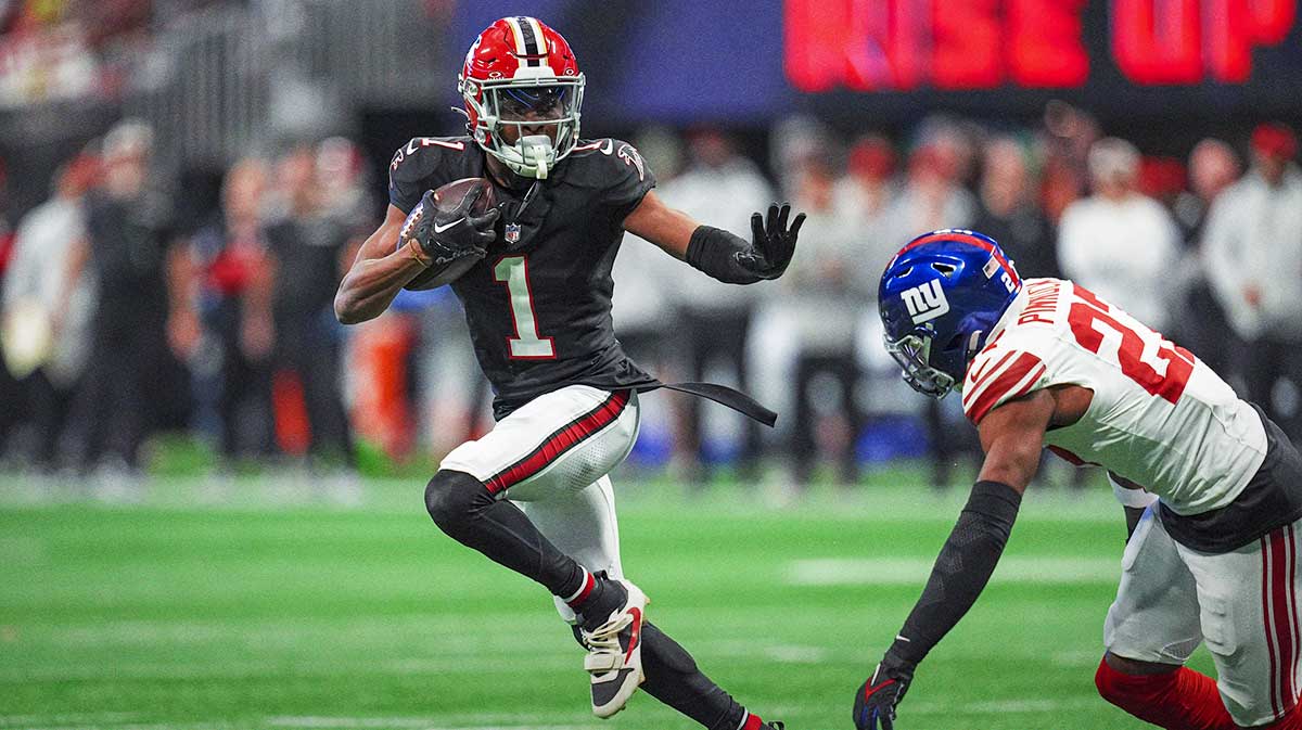 Atlanta Falcons wide receiver Darnell Mooney (1) runs against New York Giants safety Jason Pinnock (27) after a catch during the first half at Mercedes-Benz Stadium.