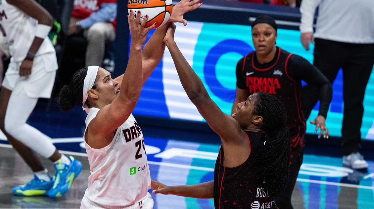 Atlanta Dream forward Brionna Jones (24) shoots the ball while Indiana Fever forward Aliyah Boston (7) defends during game two of round one for the 2025 WNBA Playoffs at Gainbridge Fieldhouse.