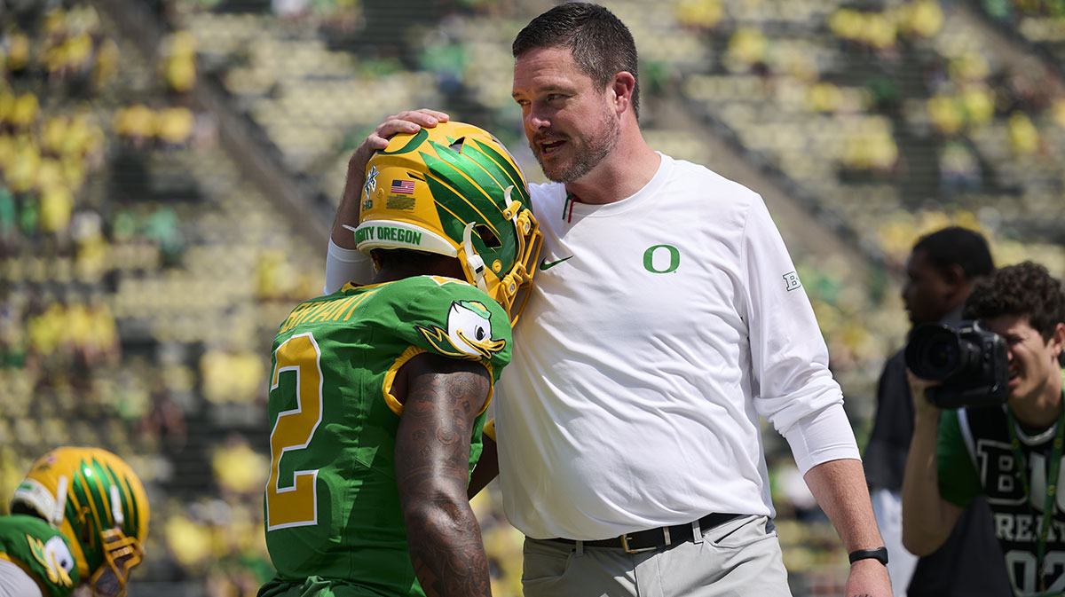 Oregon Ducks head coach Dan Lanning talks to wide receiver Gary Bryant Jr. (2) during warm ups before a game against the Montana State Bobcats at Autzen Stadium.