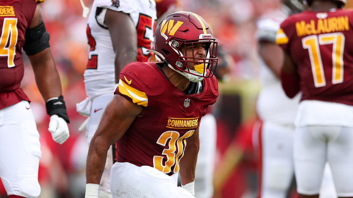 Washington Commanders running back Austin Ekeler (30) reacts after a run against the Tampa Bay Buccaneers in the second quarter at Raymond James Stadium.