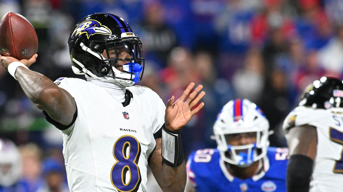 Baltimore Ravens quarterback Lamar Jackson (8) looks to pass during the fourth quarter against the Buffalo Bills at Highmark Stadium.