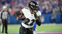 Baltimore Ravens running back Derrick Henry (22) carries the ball against the Buffalo Bills in the first quarter at Highmark Stadium.