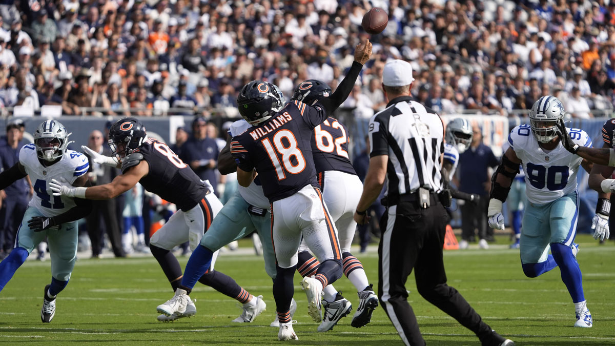 Chicago Bears quarterback Caleb Williams (18) throws a touchdown pass against the Dallas Cowboys during the first half at Soldier Field.