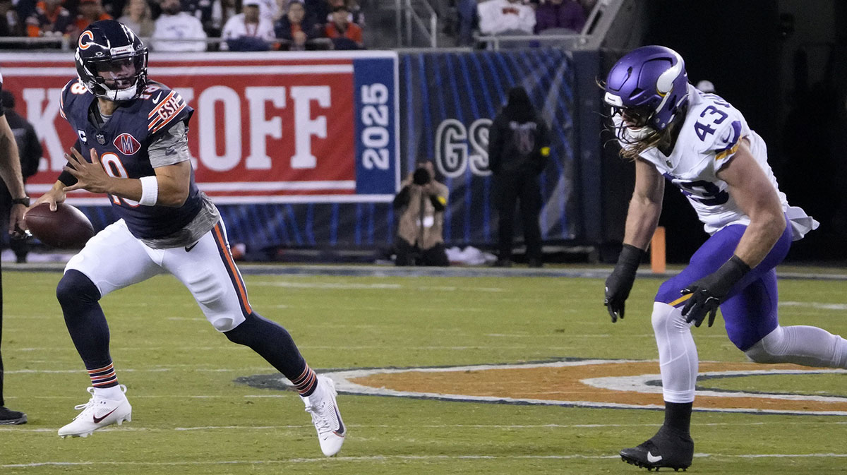 Chicago Bears quarterback Caleb Williams (18) rushes the ball against the Minnesota Vikings during the first half at Soldier Field.