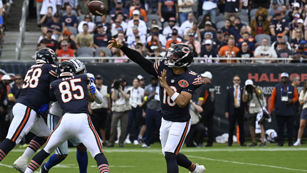 Chicago Bears quarterback Caleb Williams (18) drops back to pass against the Dallas Cowboys during the first half at Soldier Field.