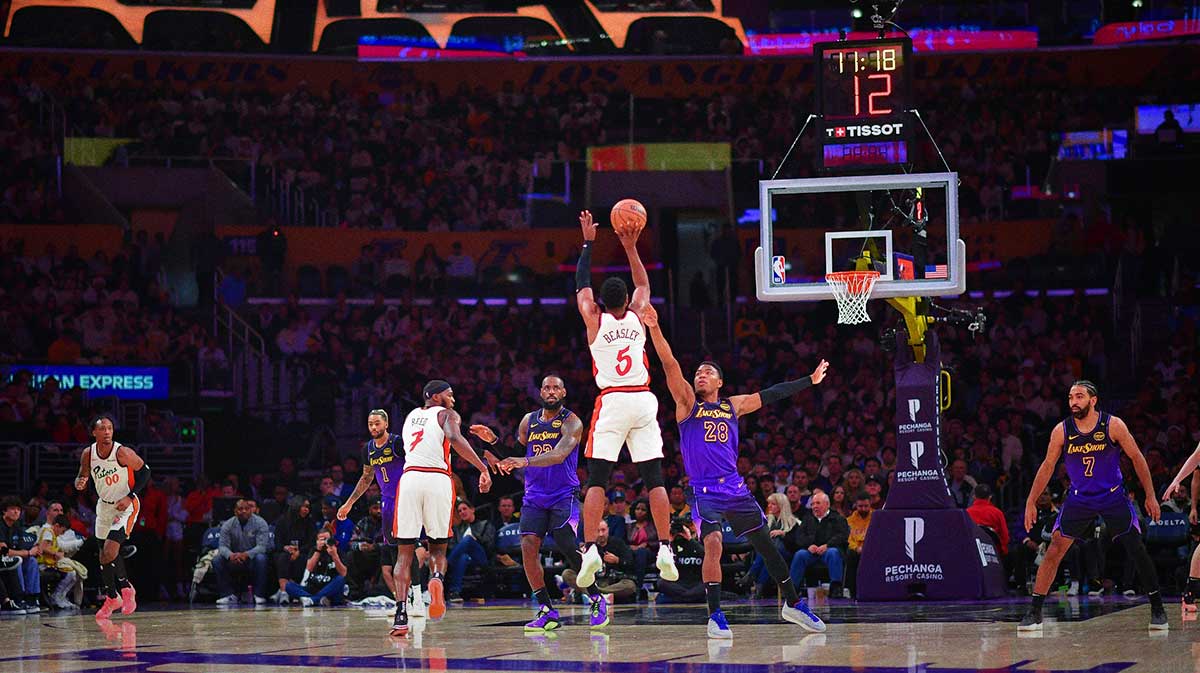 Detroit Pistons guard Malik Beasley (5) shoots against Los Angeles Lakers forward Rui Hachimura (28) during the second half at Crypto.com Arena.