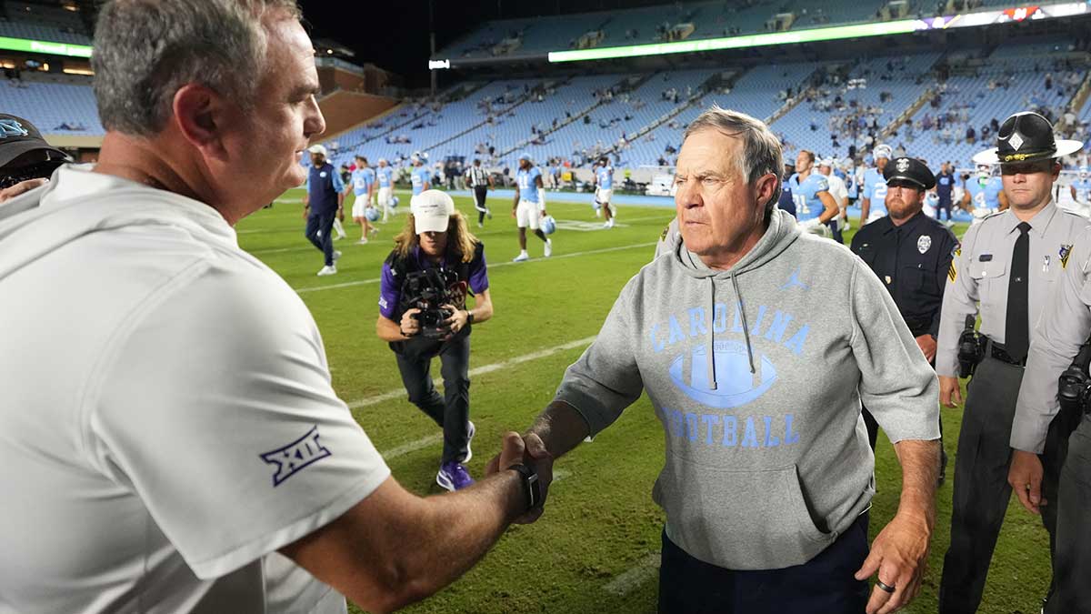 North Carolina Tar Heels head coach Bill Belichick with TCU Horned Frogs head coach Sonny Dykes after the game at Kenan Stadium.