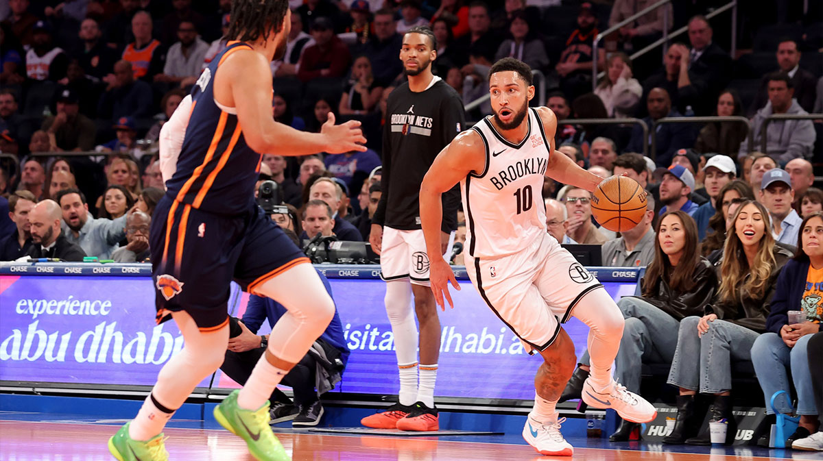 Brooklyn Nets guard Ben Simmons (10) brings the ball up court against New York Knicks guard Jalen Brunson (11) during the first quarter at Madison Square Garden.