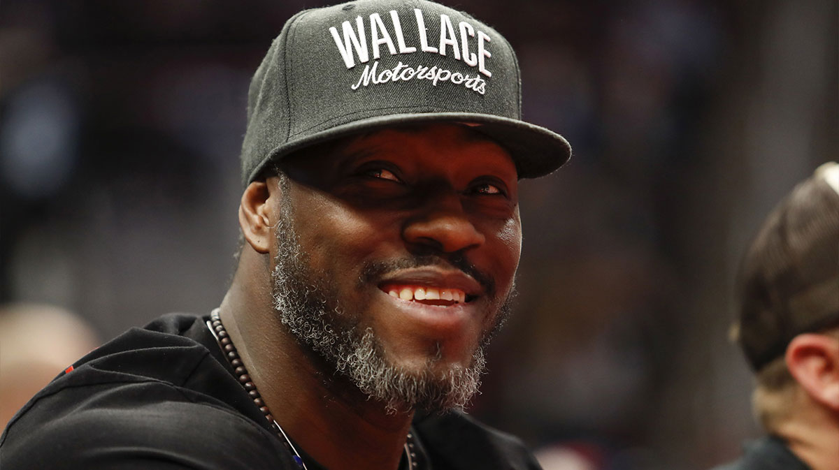 Detroit Pistons retired center Ben Wallace smiles from the stands during the second quarter against the Milwaukee Bucks at Little Caesars Arena.
