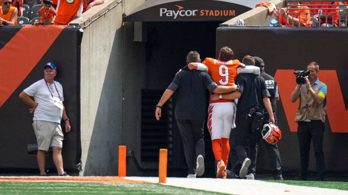 Cincinnati Bengals quarterback Joe Burrow (9) is assisted to the locker room with an injury in the second quarter of the NFL Week 2 game between the Cincinnati Bengals and the Jacksonville Jaguars at Paycor Stadium in downtown Cincinnati on Sunday, Sept. 14, 2025. The Jaguars led 17-10 at halftime.