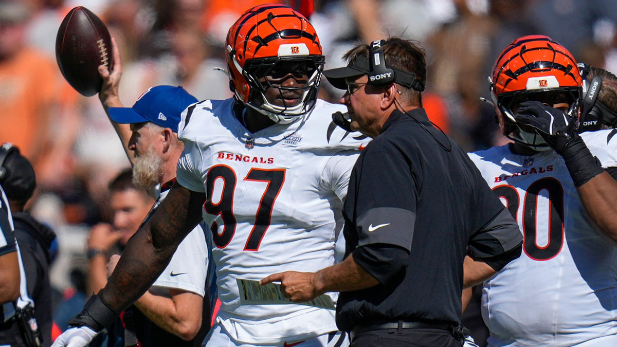 Cincinnati Bengals defensive end Shemar Stewart (97) talks with defensive coordinator Al Golden in the fourth quarter of the NFL Week 1 game between the Cleveland Browns and the Cincinnati Bengals at Huntington Bank Field in Cleveland on Sunday, Sept. 7, 2025. The Bengals begin the season with a 17-16 win over the Browns.