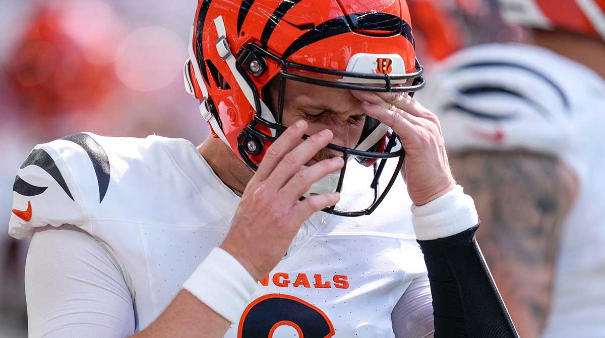 Cincinnati Bengals quarterback Jake Browning (6) pulls his helmet on in the first quarter of the NFL Week 3 game between the Minnesota Vikings and the Cincinnati Bengals at U.S. Bank Stadium in Minneapolis on Sunday, Sept. 21, 2025.