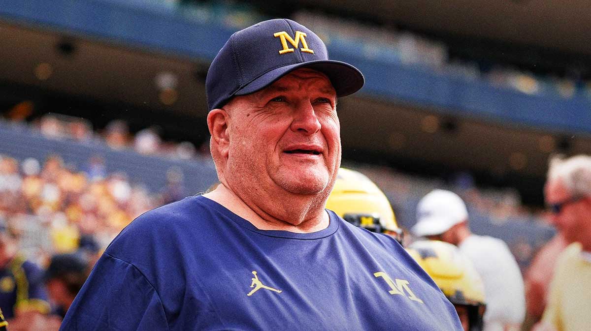 Michigan acting head coach Biff Poggi walks onto the field for second half against Central Michigan at Michigan Stadium in Ann Arbor on Saturday, Sept. 13, 2025.