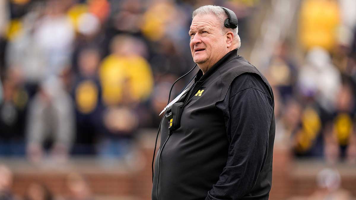Michigan associate head coach Biff Poggi watches a play during the first half of the spring game at Michigan Stadium