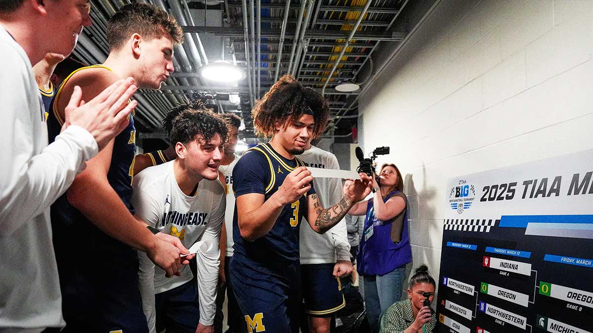 Michigan guard Tre Donaldson (3) and teammates celebrate advancing to the Big Ten Tournament final after defeating Maryland 81-80 at Gainbridge Fieldhouse in Indianapolis, Ind. on Saturday, March 15, 2025.